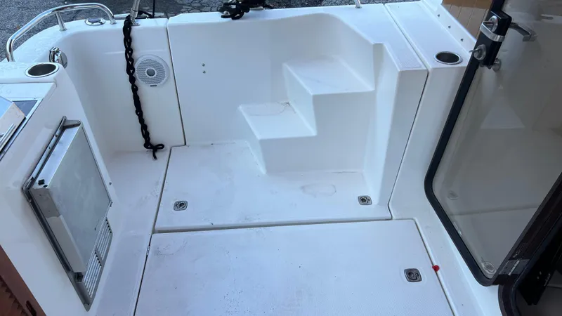 Slide: The Image of 2014 Ranger Tugs R29S boat deck with steps and storage compartments. - 36