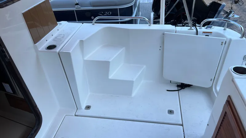 Slide: The Image of 2014 Ranger Tugs R29S boat deck with steps and railing. - 37