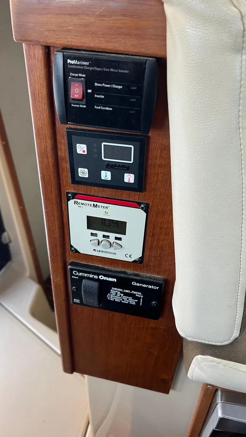 Slide: The Image of Control panel on 2014 Ranger Tugs R29S boat with generator and inverter displays. - 41