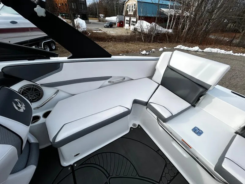 Slide: The Image of 2024 Scarab 215 Wake LE boat interior with white and gray seating. - 12