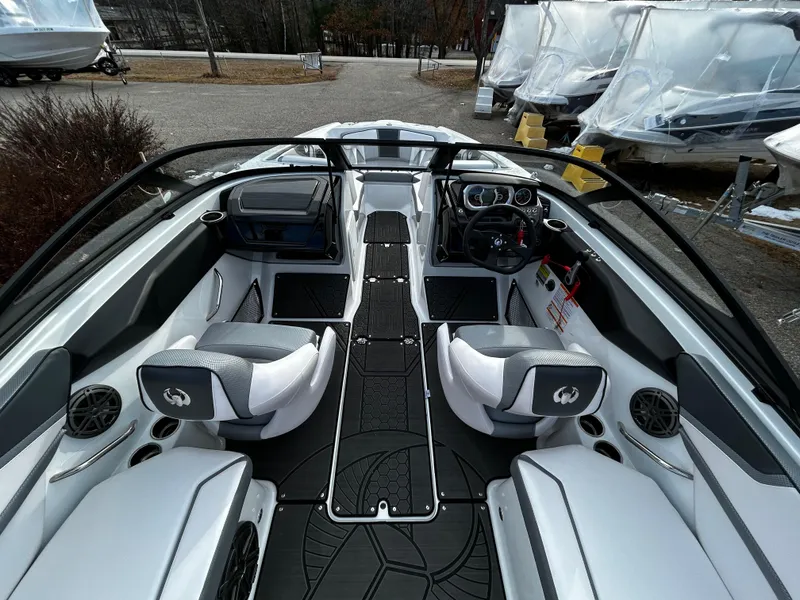 Slide: The Image of 2024 Scarab 215 Wake LE boat interior with sleek seating and modern dashboard. - 16