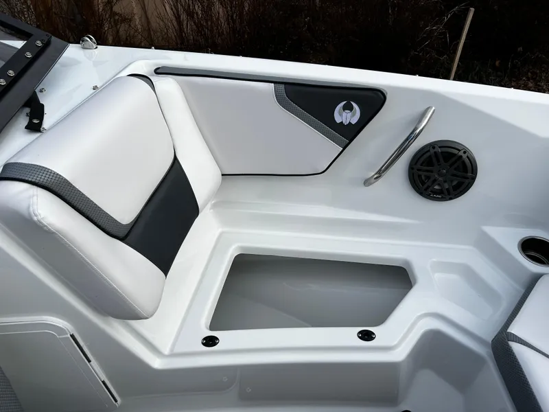 Slide: The Image of 2024 Scarab 215 Wake LE boat interior seating with storage compartment. - 25