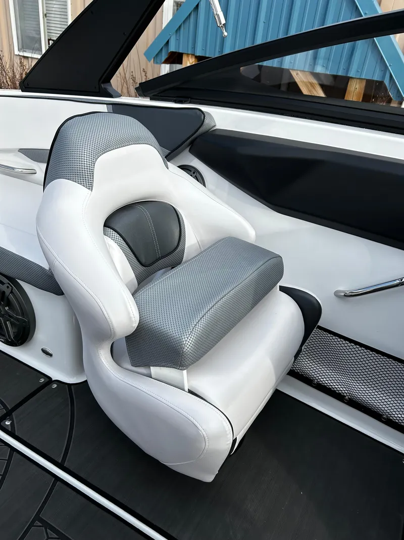 Slide: The Image of 2024 Scarab 215 Wake LE boat interior seat with gray and white upholstery. - 49