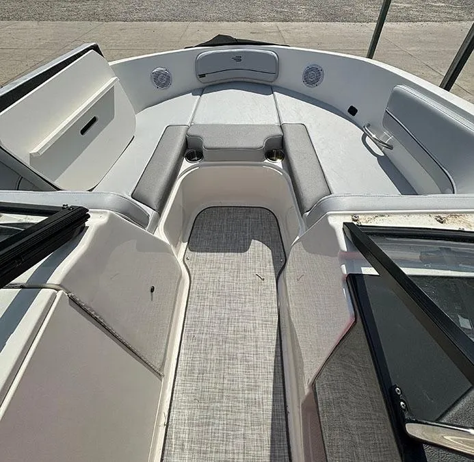 Slide: The Image of 2024 Bayliner VR6 boat interior with spacious seating and modern design. - 4