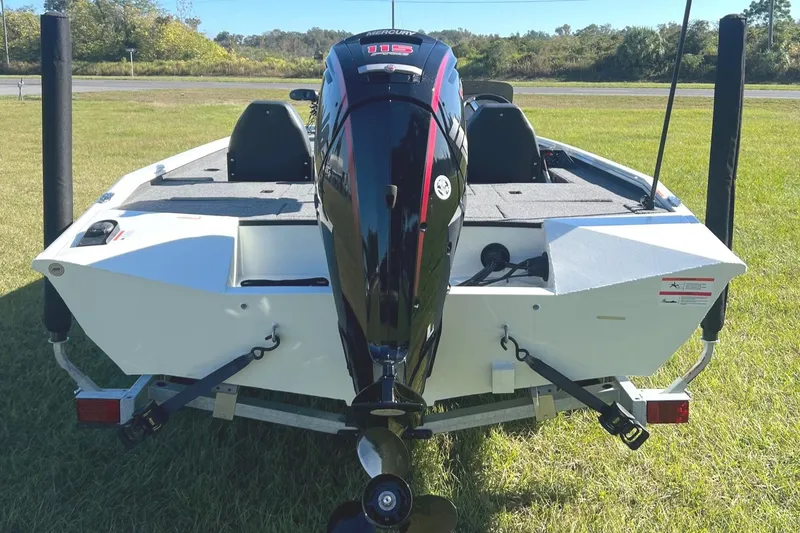 Slide: The Image of 2024 Lowe Stinger 188 SC boat rear view with outboard motor. - 3
