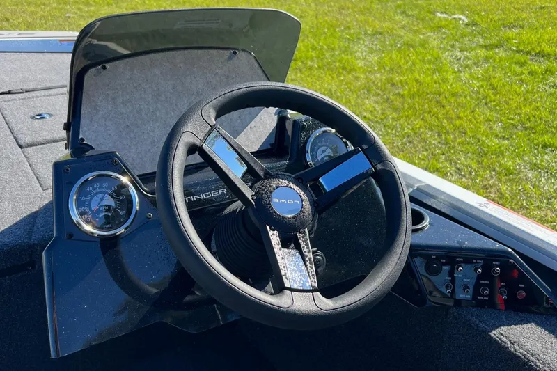 Slide: The Image of 2024 Lowe Stinger 188 SC boat steering wheel and dashboard. - 9