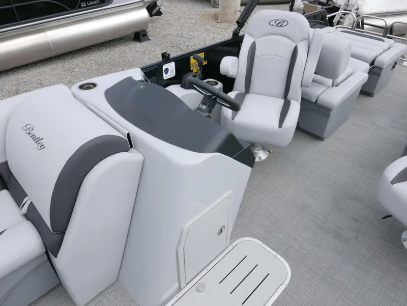 Slide: The Image of 2024 Bentley Pontoons Legacy 223 QSB interior with plush seating and modern helm. - 13