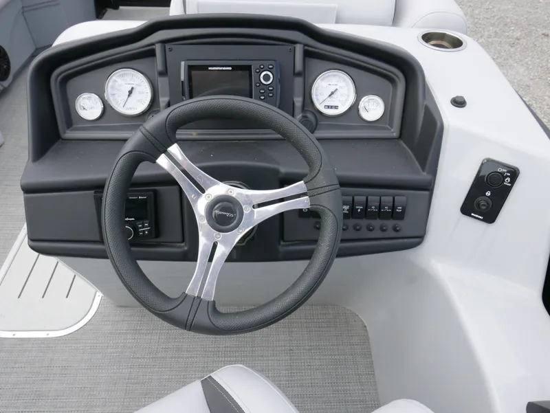 Slide: The Image of 2024 Bentley Pontoons Legacy 223 QSB dashboard with steering wheel and gauges. - 15