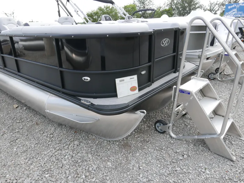 Slide: The Image of 2024 Bentley Pontoons Legacy 223 QSB pontoon boat with ladder on gravel. - 2