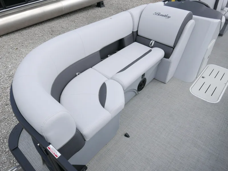 Slide: The Image of 2024 Bentley Pontoons Legacy 223 QSB interior seating, featuring luxurious gray upholstery. - 6