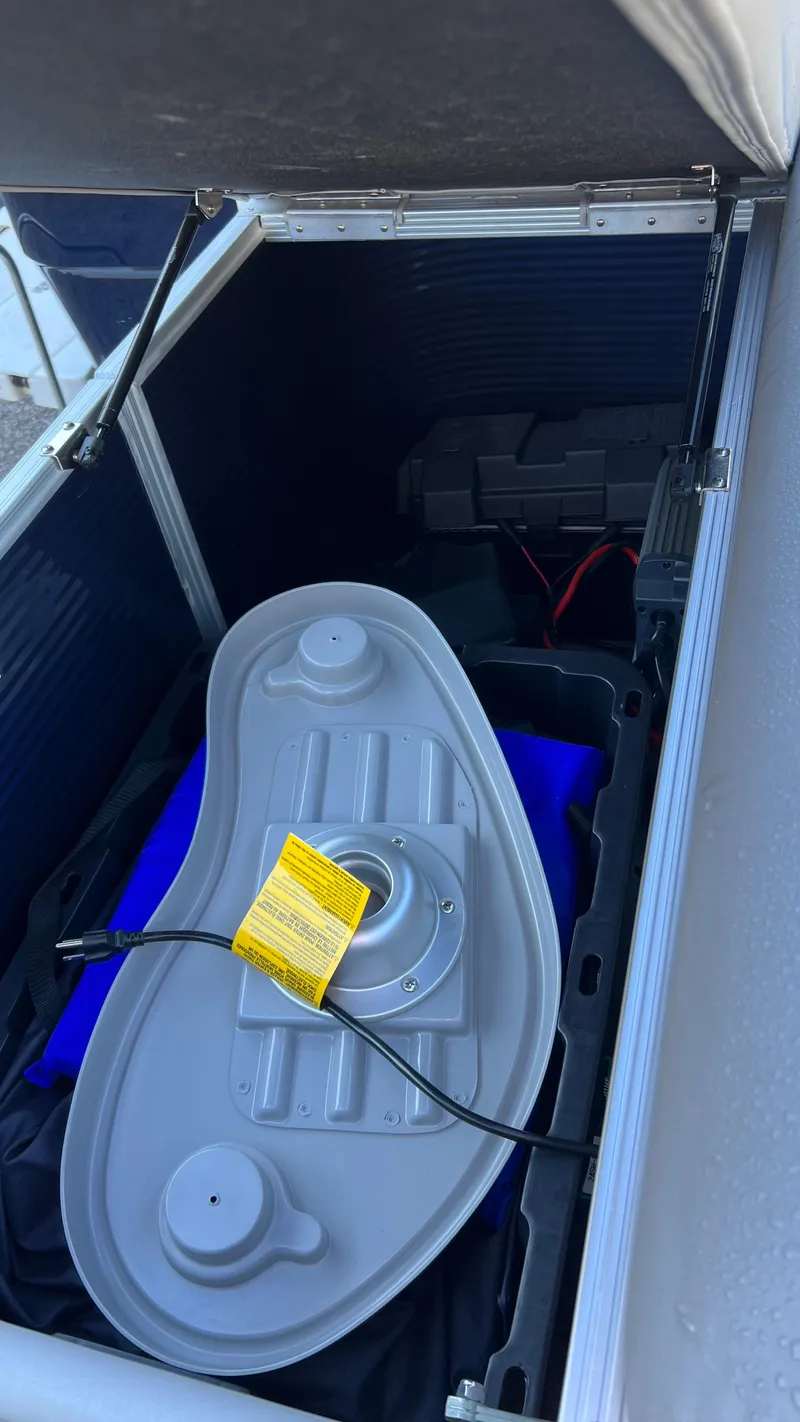Slide: The Image of Storage compartment of a 2021 Bennington S20 boat with equipment inside. - 11