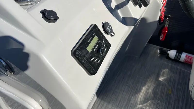 Slide: The Image of Control panel of a 2021 Bennington S20 boat with Kicker stereo system. - 13