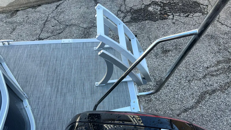 Slide: The Image of 2021 Bennington S20 boat deck with aluminum ladder and railing. - 9