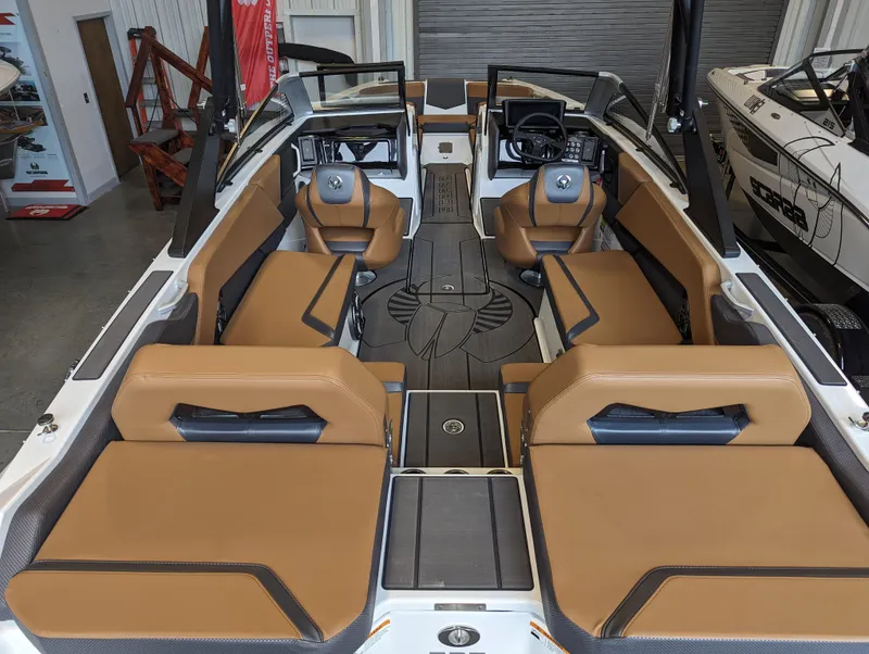 Slide: The Image of 2024 Scarab 235 ID boat interior with tan seating and modern design. - 10