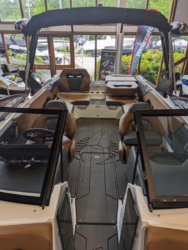 Slide: The Image of 2024 Scarab 235 ID boat interior with seating and helm station. - 4