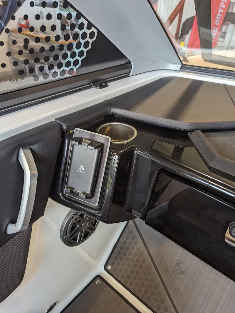 Slide: The Image of 2024 Scarab 235 ID boat interior with cup holder and speaker. - 7