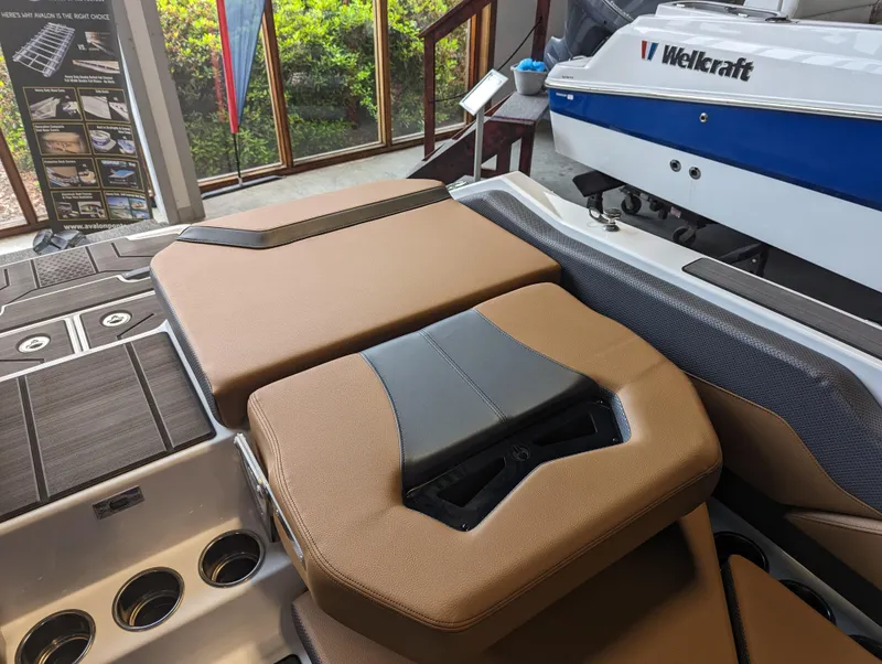 Slide: The Image of 2024 Scarab 235 ID boat interior with tan and black seating. - 9