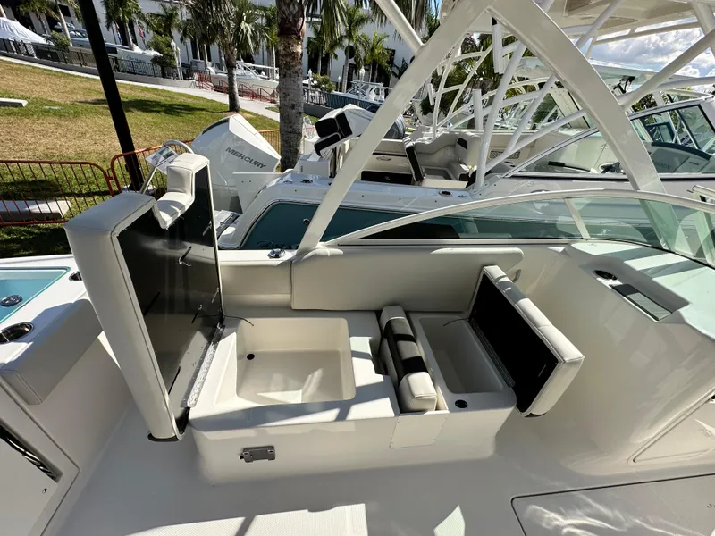Slide: The Image of 2024 Sailfish 226 DC boat interior with seating and storage compartments. - 10