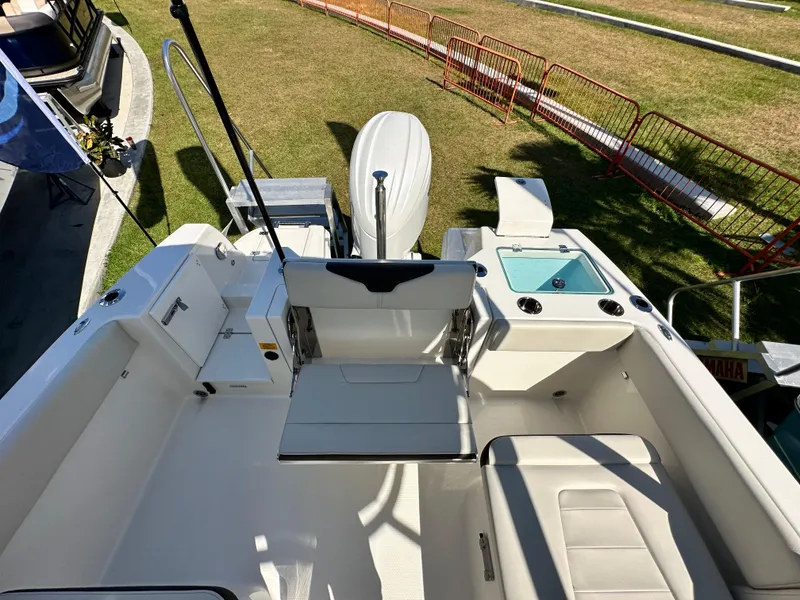 Slide: The Image of 2024 Sailfish 226 DC boat interior with seating and storage compartments. - 11