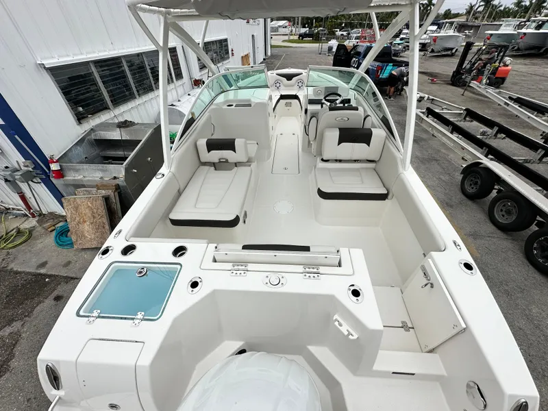 Slide: The Image of 2024 Sailfish 226 DC boat interior with seating and control console. - 23