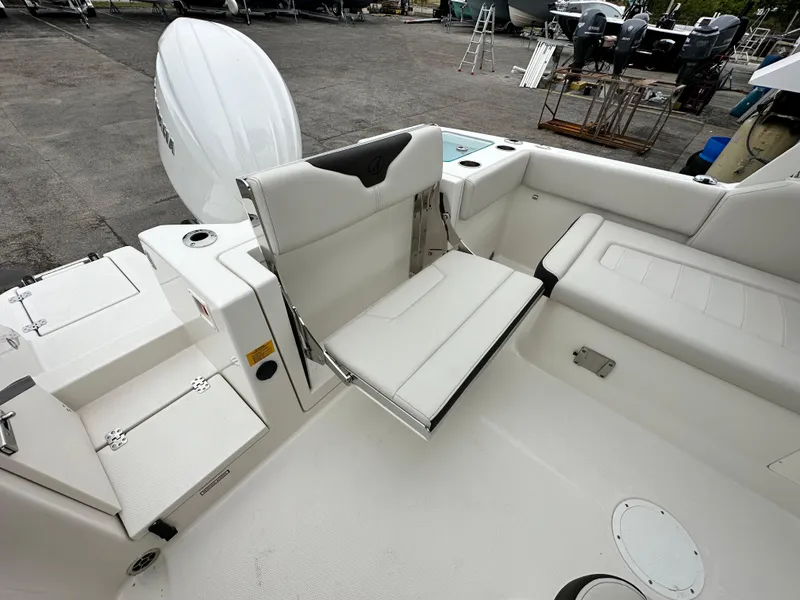 Slide: The Image of 2024 Sailfish 226 DC boat interior with foldable seating and storage compartments. - 33