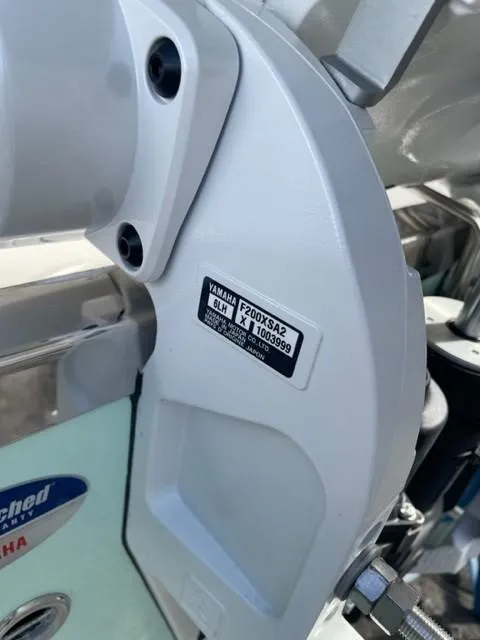 Slide: The Image of 2024 Sailfish 226 DC boat with Yamaha F200XSA2 engine detail. - 37