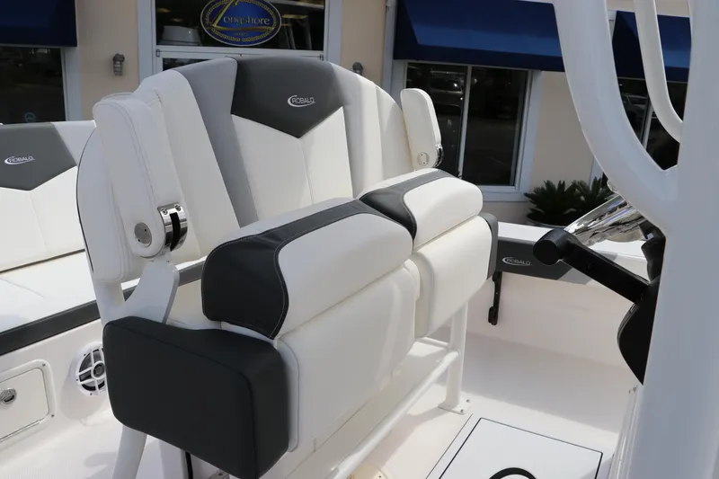 Slide: The Image of 2024 Robalo 226 Cayman boat with cushioned seating and modern design. - 15