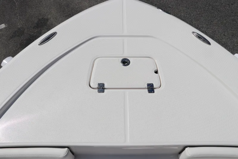 Slide: The Image of 2024 Robalo 226 Cayman boat deck with storage hatch. - 20