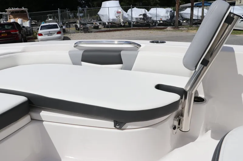Slide: The Image of 2024 Robalo 226 Cayman boat interior seating and storage area. - 24