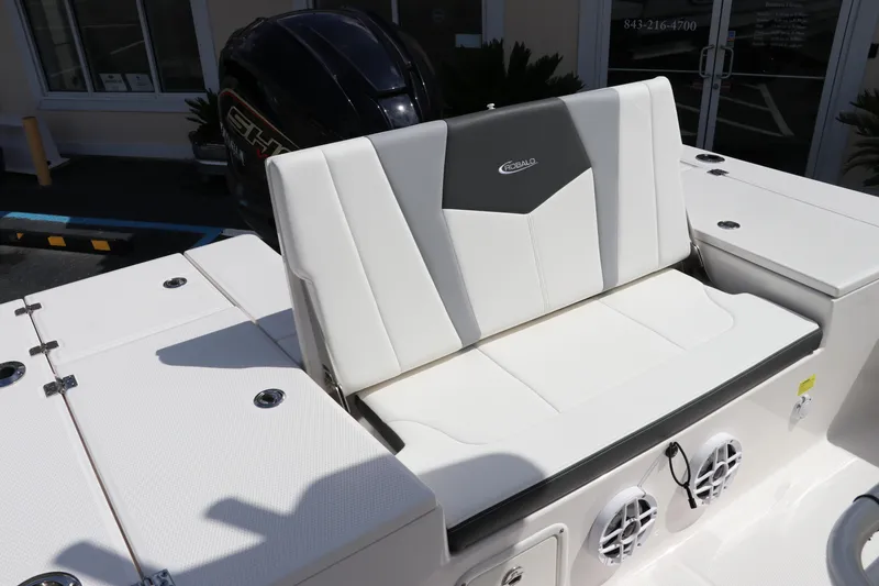 Slide: The Image of 2024 Robalo 226 Cayman boat seating and engine detail. - 8