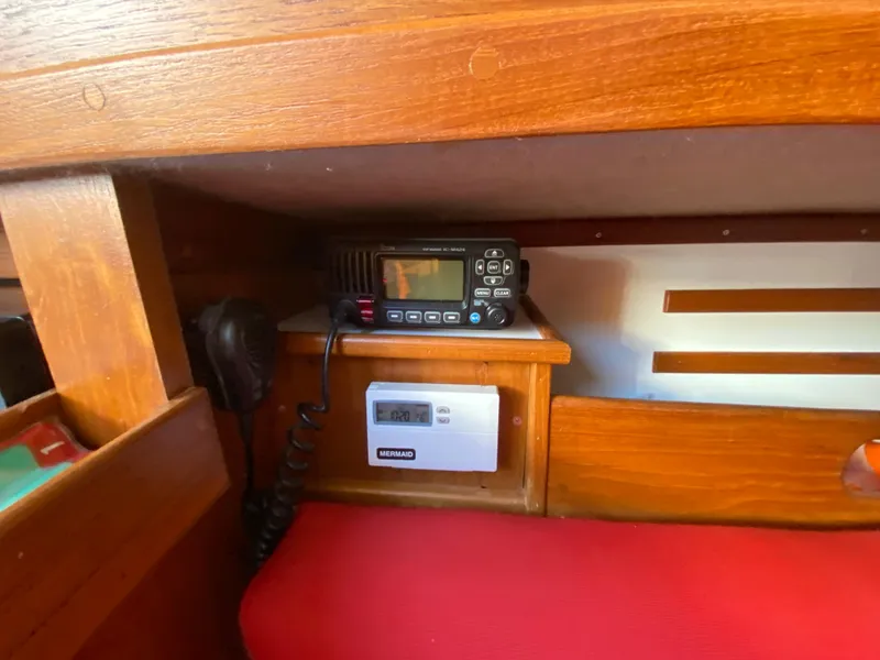 Slide: The Image of Interior of a 2014 Com-Pac 27 sailboat with radio and control panel. - 24