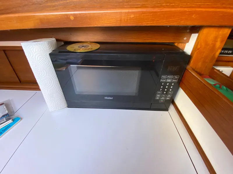 Slide: The Image of Microwave in the galley of a 2014 Com-Pac 27 sailboat. - 31
