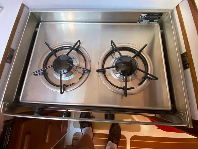 Slide: The Image of Stainless steel two-burner stove on a 2014 Com-Pac 27 sailboat. - 32