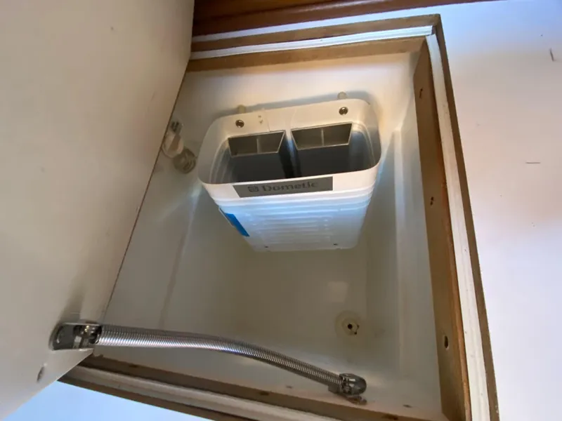 Slide: The Image of Built-in storage compartment on a 2014 Com-Pac 27 sailboat. - 34
