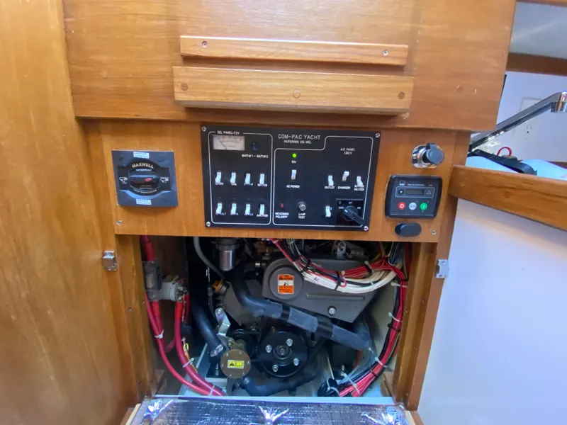 Slide: The Image of Control panel and engine compartment of a 2014 Com-Pac 27 yacht. - 38
