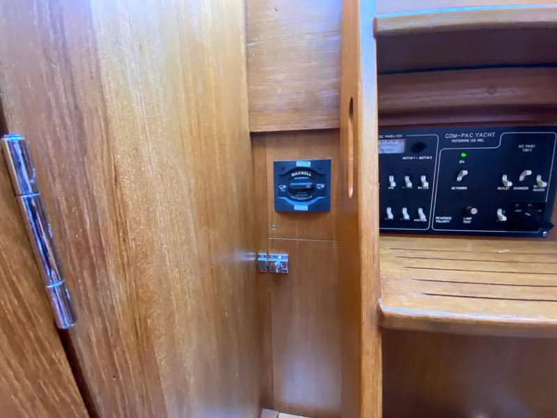 Slide: The Image of Electrical control panel and switch inside a 2014 Com-Pac 27 yacht. - 43