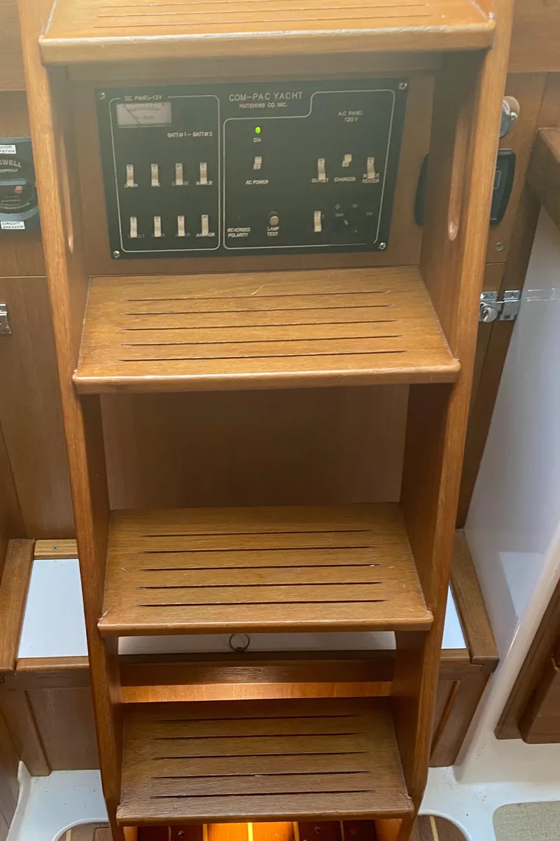 Slide: The Image of Wooden steps and control panel inside a 2014 Com-Pac 27 yacht. - 47