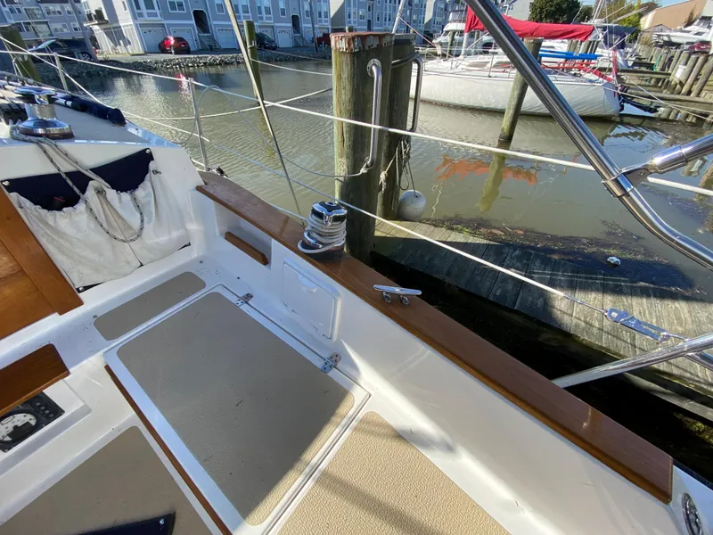 Slide: The Image of Cockpit of 2014 Com-Pac 27 sailboat docked at marina. - 49