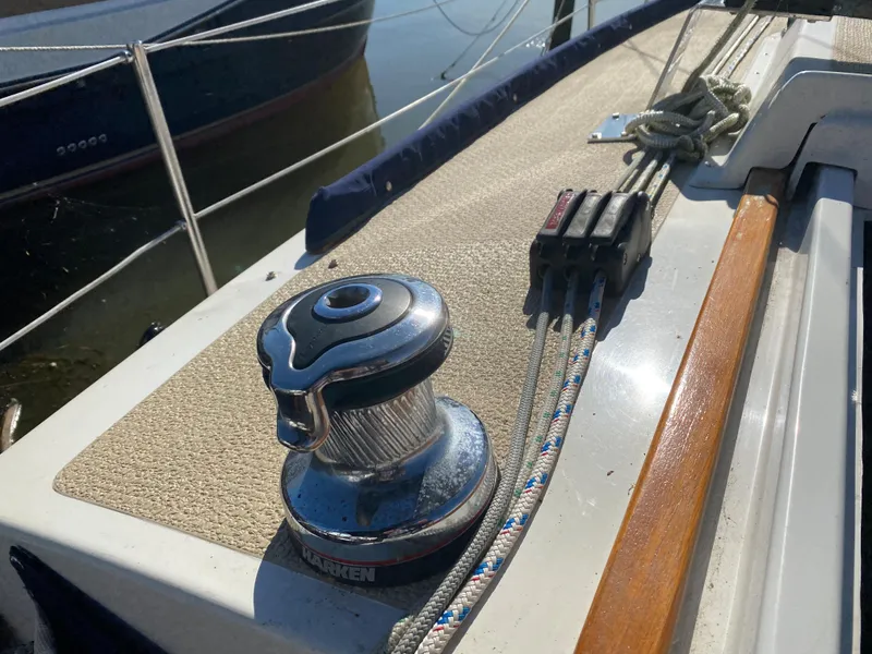 Slide: The Image of Close-up of a 2014 Com-Pac 27 sailboat winch and rope clutches. - 6