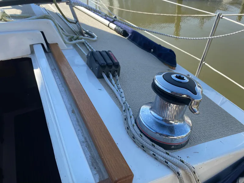 Slide: The Image of Deck of 2014 Com-Pac 27 sailboat with winch and rope clutches. - 7