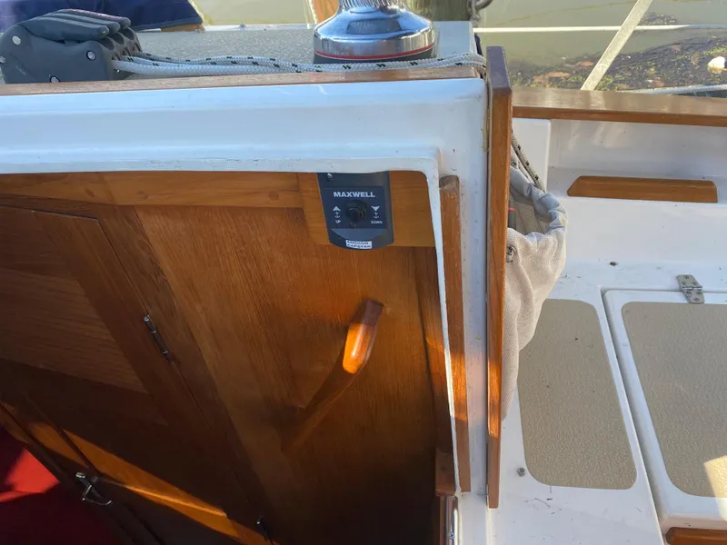 Slide: The Image of Com-Pac 27 sailboat interior, wooden cabinetry, Maxwell control panel, 2014 model. - 9