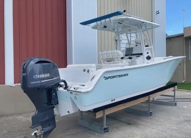 Slide: The Image of 2014 Sportsman Heritage 251 Center Console boat with Yamaha outboard motor. - 1