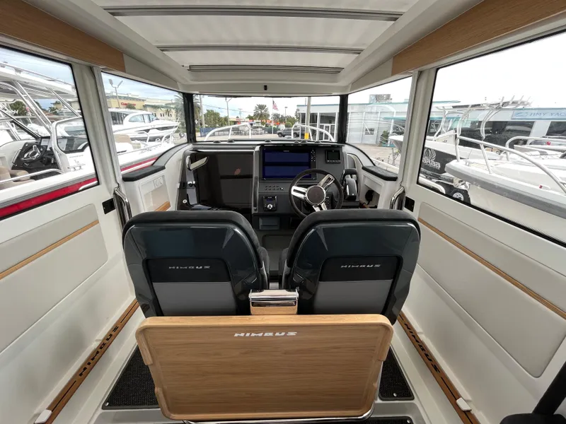 Slide: The Image of Interior of 2024 Nimbus Commuter 9 #136 boat with modern dashboard and seating. - 22