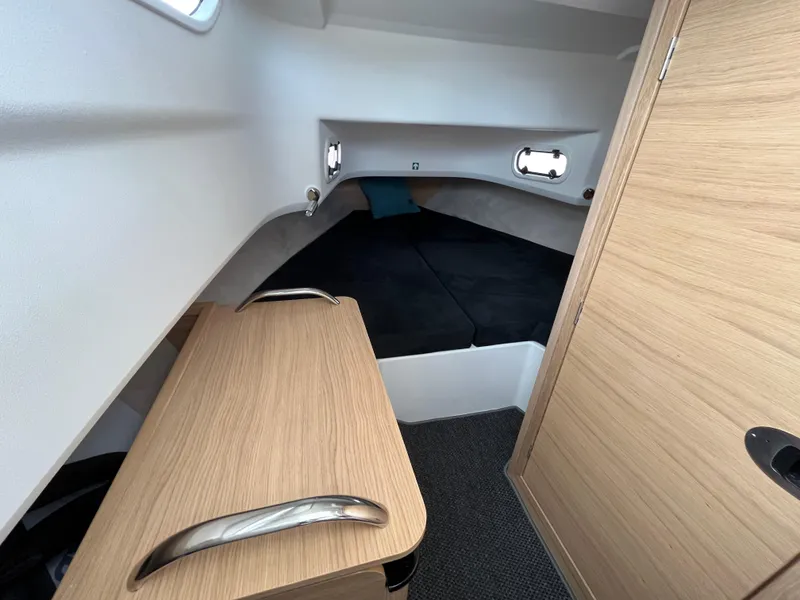 Slide: The Image of 2024 Nimbus Commuter 9 #136 cabin interior with bed and wooden furniture. - 26
