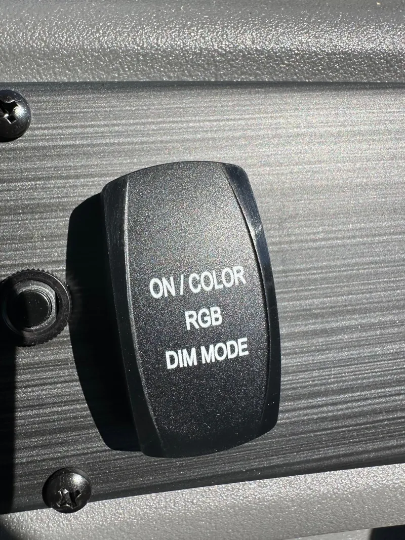 Slide: The Image of Switch panel with "ON/COLOR," "RGB," and "DIM MODE" options on Bennington 21 SSR Quad Bench. - 14