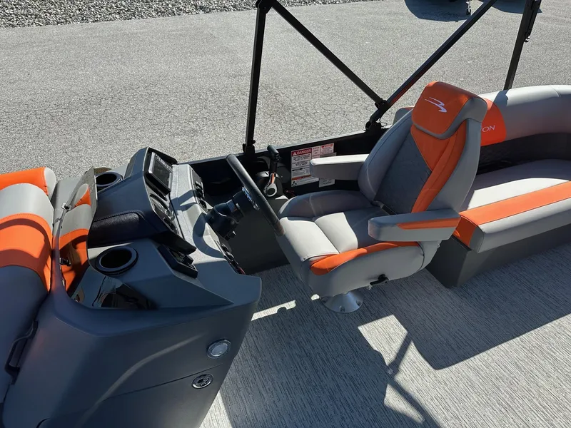 Slide: The Image of 2025 Bennington 21 SSR Quad Bench interior with orange and gray seating. - 15