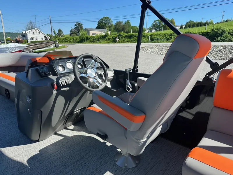 Slide: The Image of 2025 Bennington 21 SSR Quad Bench boat interior with steering wheel and seating. - 31