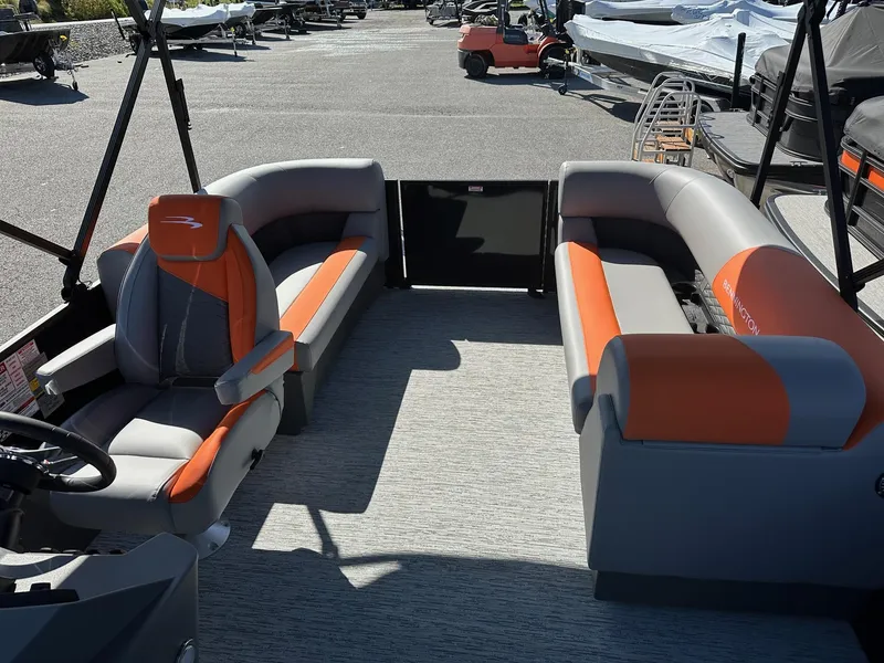 Slide: The Image of 2025 Bennington 21 SSR Quad Bench boat interior with orange and gray seating. - 32