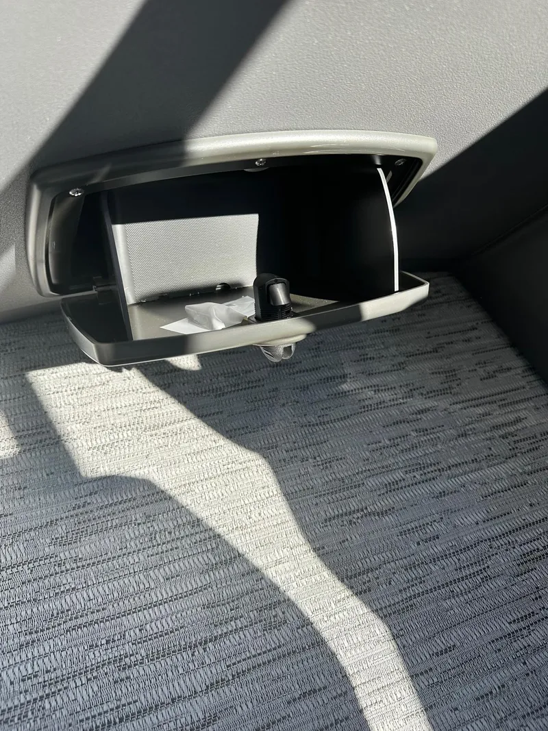 Slide: The Image of Open storage compartment in 2025 Bennington 21 SSR Quad Bench boat interior. - 36