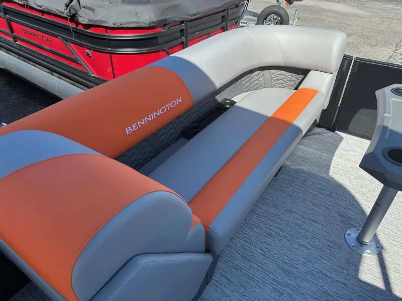Slide: The Image of 2025 Bennington 21 SSR Quad Bench with orange and gray seating, in stock. - 8